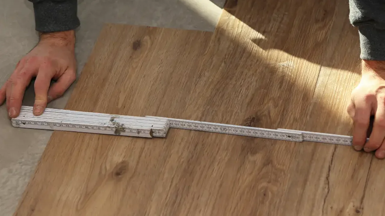 Floor repair service fixing damaged hardwood in a Vancouver WA home